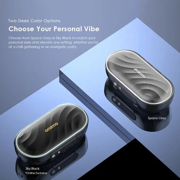 Oraimo SpaceBox 8W FM Wireless Speaker Upto 16 Hours Playtime - Neo Tech AccessoriesTwo oraimo SpaceBox in space grey and sky black on a reflective surface with promotional text.